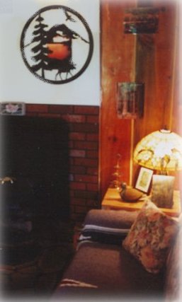 Living Room, Gas Fireplace, Tiffany Lamps - cabins on the river in the forest at Gathering Light ... a retreat for nature lovers, a retreat for writers and artists, for lovers and honeymooners and a peaceful, personal spiritual retreat. Offering private, studio cabins, treehouses, vacation rentals, group and family lodging, the retreat is located in southern oregon near crater lake national park.