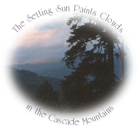 the setting sun paints the clouds in the cascade mountains near gathering light ... a retreat in southern oregon near crater lake national park: cabins, tree houses on the river in the forest.